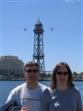 Richard and Melanie in front of the cable car over barcelona harbour