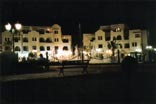 The fountain and restaurants at the marina by night
